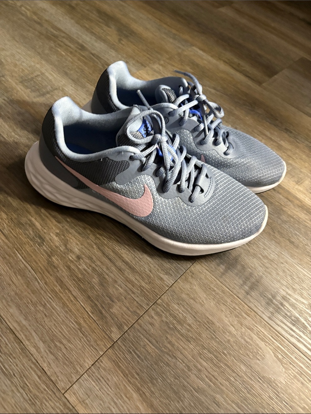 Nike Women's Light Gray Running Sneakers with Pink Swoosh